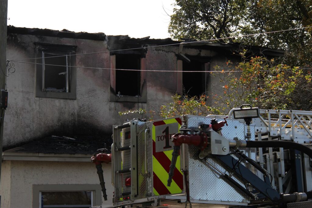 A fire truck outside a home after a house fire