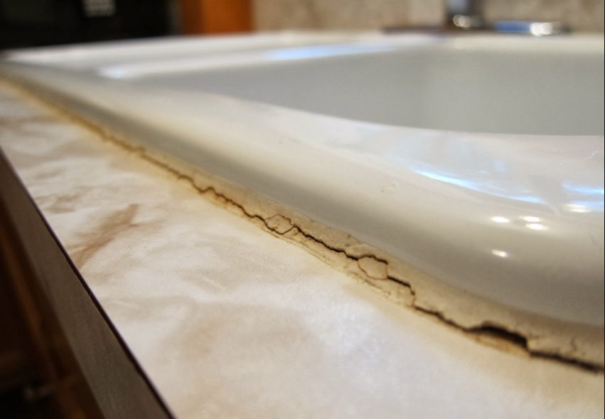 Cracked caulking around a sync