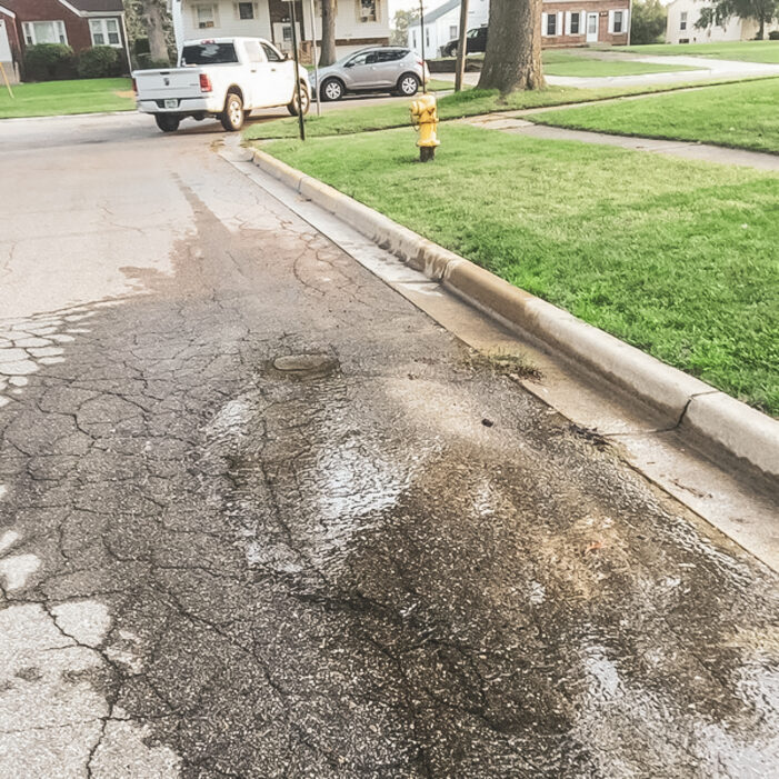 Water main break wetting the road